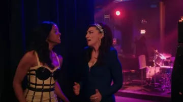 Karen Millen Ban­dage Knit­ted Jump­suit worn by Dawn Solano (Sara Bareilles) as seen in Girls5eva (S03E02)