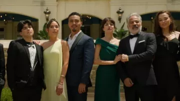 Ieena Duggal Asym­met­ric Off-Shoul­der Neckline High Slit Gown worn by Lettie Sandoval (Cecilia Suárez) as seen in Promised Land (S01E01)