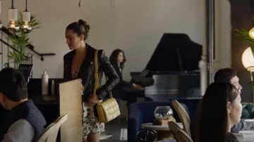 Bottega Veneta Padded Cassette Bag In Sherbert worn by Carmen Sandoval (Mariel Molino) as seen in Promised Land (S01E03)
