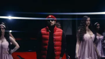 Moncler Red Triangle Patch Beanie worn by Jesus Ortiz Paz in TU NAME by Fuerza Regida [Official Video]