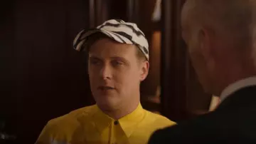 Dries Van Noten Giles Cap worn by Elliott Goss (John Early) as seen in Search Party (S05E05)