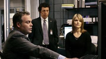 The badge of Captain Daniel Ross (Eric Bogosian) in New York, criminal division