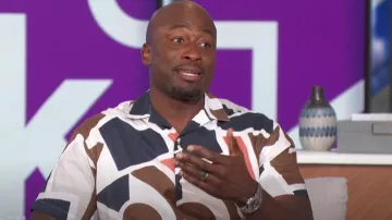 Jack & jones Pre­mi­um Ab­stract Print Camp Col­lar Short Sleeve Shirt worn by Akbar Gbaja-Biamila as seen in The Talk on April 3, 2024