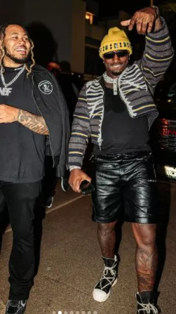 Ché by Ché Pantalones cortos negros brillantes de doble capa usados por Deebo Samuel en la cuenta de Instagram @1deebosr