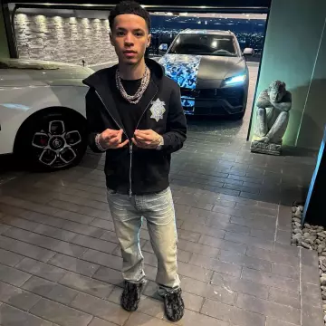 Dior Dark Grey Oblique Shearling Slippers worn by Lil Mosey on the Instagram account @lilmosey