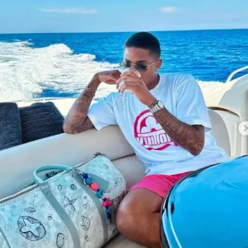 Louis Vuitton Bright Pink Monogram Swim Shorts worn by Marcus Rashford on the Instagram account @footballerfits