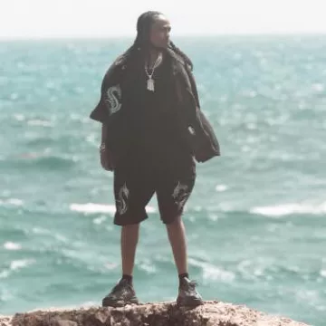 Alexander Wang Black Velour Drag­on Shorts worn by Quavo on the Instagram account @quavohuncho
