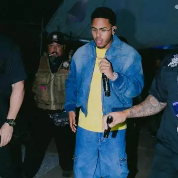 Givenchy Yellow 'Reverse Paris' T-Shirt worn by Myke Towers on the Instagram account @myketowers