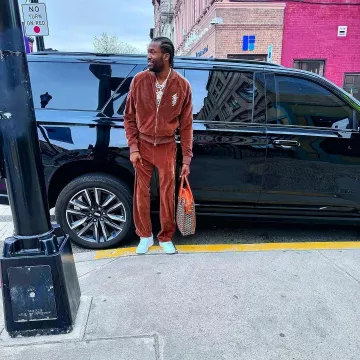 Amiri Brown Velour Stacked Logo Track Jacket worn by Meek Mill on the Instagram account @meekmill