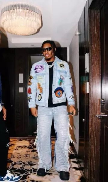 Who Decides War Light Blue Destroyed Side Scripture Jeans worn by Justin Jefferson on the Instagram account @jjettas2