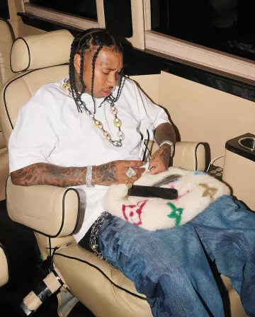 Louis Vuitton White Monogram Mink Belt Bag worn by Tyga on the Instagram account @tyga