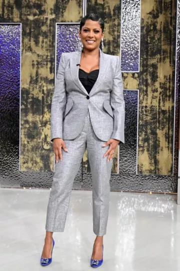 Alexander McQueen Metal­lic Peak Shoul­der Blaz­er worn by Tamron Hall at The Tamron Hall Show on April 23, 2024