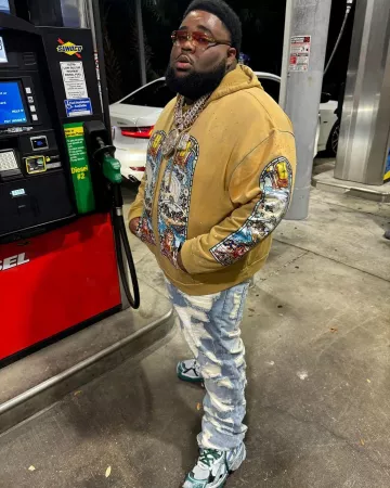 Balenciaga White Light Blue & Green 'Runner' Sneakers worn by Rod Wave on the Instagram account @rodwave