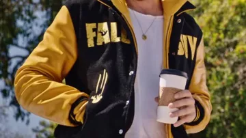 Get the look from The Fall Guy Promotion: Hooded Varsity Jacket worn by Ryan Gosling in The Fall Guy Carpool Marketing Video