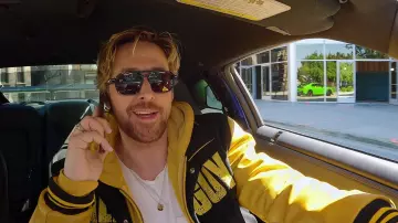 Get the look from The Fall Guy Promotion: Hooded Varsity Jacket worn by Ryan Gosling in The Fall Guy Carpool Marketing Video