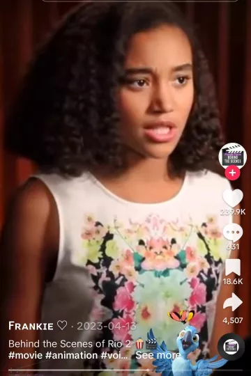 H&M White Orchid Flower Garden Silky Cami Tank Top worn by Amandla Stenberg in behind the scenes of 'Rio 2'