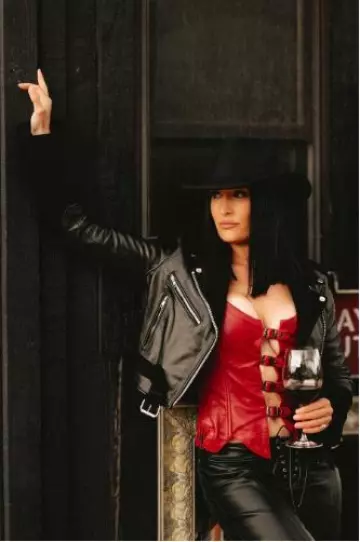Understated Leather Finish Line Corset Top worn by Nikki Bella on her Instagram Post on April 26, 2024