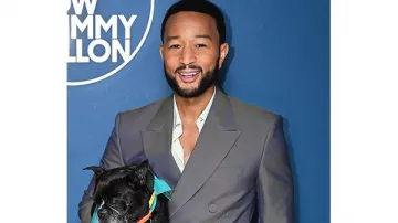John Legend Outfits: he is wearing a grey suit in The Tonight Show TV show