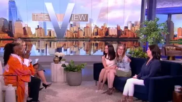 Versace Medusa Buckle Leather Slingback Pumps worn by Sofia Carson as seen in The View on May 2, 2024