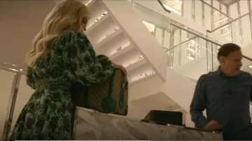 Gucci Python Trim Duf­fle Bag with Dou­ble G worn by Serena Croker (Sarah Jones) as seen in A Man in Full (S01E02)