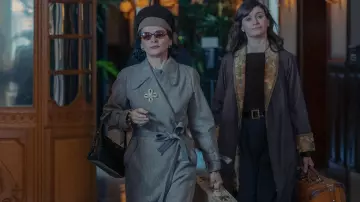 The New Look Outfits: Juliette Binoche is wearing a grey wool trench coat to portray Coco Chanel in season 1 of the TV series