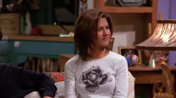 Friends Outfits: Rachel Green (Jennifer Aniston) is wearing Black and White Rose Graphic Long Sleeve Tee in season 1, episode 13