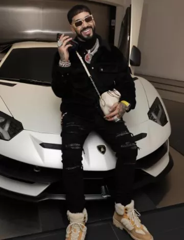 Bottes de travail en daim et peau de mouton beiges Amiri portées par Anuel AA sur le compte Instagram @anuel