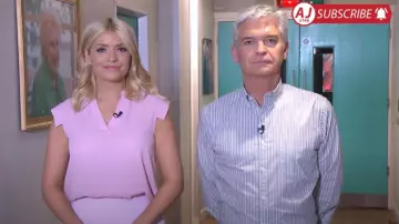This Morning Wardrobe: Holly Willoughby is wearing a pink blouse top on July 12, 2016