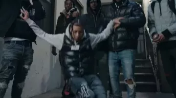 Amiri Storm Grey Staggered Logo 'Stack' Jeans worn by DD Osama in DD Osama - Rule No. 1
