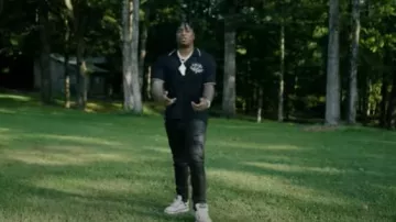 Polo noir Amiri 'Arts District' porté par Fredo Bang dans Fredo Bang - By The Evening (Vidéo officielle)