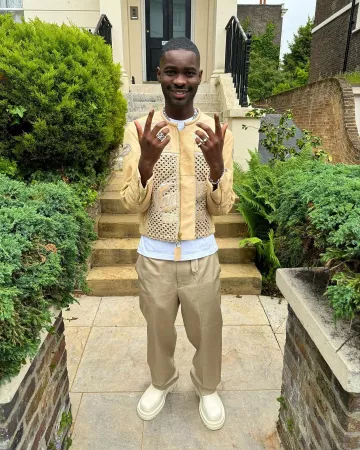 Bottega Veneta Ivory Tall 'Tire' Boots worn by Dave on the Instagram account @santandave
