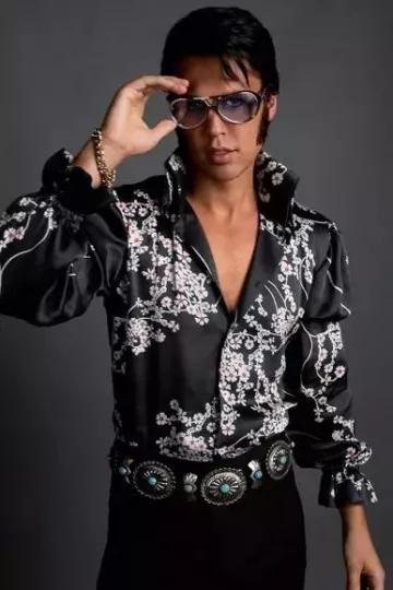 Elvis Movie Outfits: Austin Butler is wearing floral black shirt on promotional picture