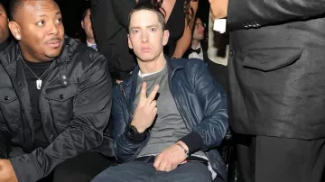 Eminem Outfits: the American rapper is wearing Blue Leather jacket at 2011 Grammy Awards