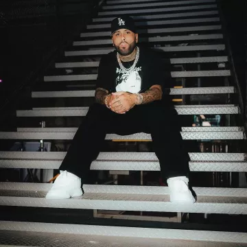 Palm Angels Black Velvet Small Logo Trackpants worn by Nicky Jam on the Instagram account @nickyjam
