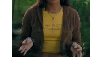 Clothing form Madame Web: Anya Corazón (Isabela Moner) is wearing brown velvet hoodie jacket