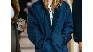 Syd­ney Sweeney Outfits: Blue Hooded Trench Coat worn by the actress seen on the set of Madame Web in Grand Central Station on October 11, 2022 in New York City
