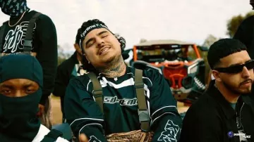 Supreme x Fox Racing Black Moto Jersey (FW23) worn by That Mexican OT in That Mexican OT - Comin Down (feat. OTB Fastlane & Hannah Everhart) (Official Music Video)