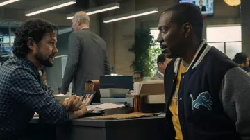 Beverly Hills Cop: Axel F Outfits: Eddie Murphy is wearing Teddy jacket from Detroit Lions to portray Axel Foley in the movie