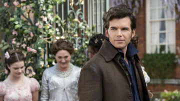 Bridgerton Outfits: Luke Newton is wearing a Brown coat as Colin Bridgerton in season 3