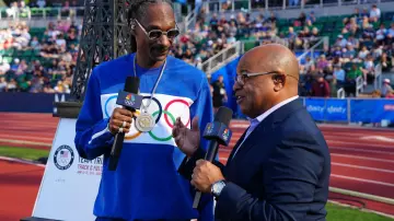 Snoop Dogg is wearing US Olympic Blue Tracksuit for Track & Field Olympic Trials at Eugene on June 2024