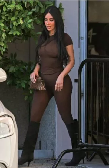 Skims Fits Everybody Short-Sleeve Crewneck T-Shirt worn by  Kim Kardashian West in Los Angeles on June 21, 2024