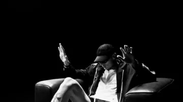 Celine Black & White-Stripe Zip Track Hoodie worn by Peso Pluma in VINO TINTO (Video Oficial) - Peso Pluma, Natanael Cano, Gabito Ballesteros