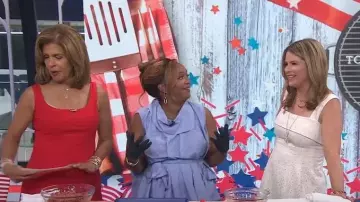 Metamorphoza Draped Belted Top in Blue worn by Sunny Anderson as seen in Today on July 4, 2024