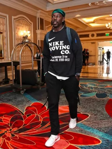 Nike Black Nike Moving Co. Long Sleeve T-Shirt worn by Jrue Holiday on the Instagram account @nbafashionfits