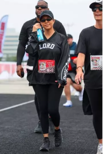 Balenciaga Thin Rectangular Sunglasses worn by  Kourtney Kardashian at Run Travis Run 5K Marathon on July 6, 2024