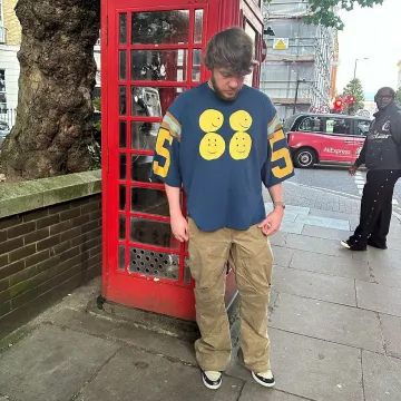 Kapital Navy Four Smiley Football T Shirt worn by Murda Beatz on the Instagram account @murdabeatz