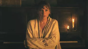 Taylor Swift is wearing White Knit Cardigan with stars in her Cardigan music video