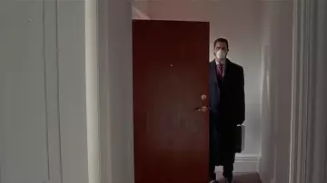American Psycho Wardrobe: Christian Bale is wearing Trench Coat to portray Patrick Bateman in the movie