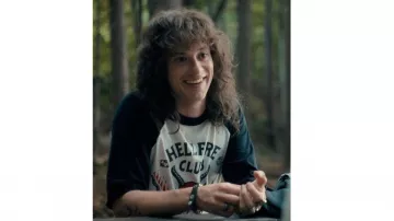 Stranger Things TV series outfits: Eddie Munson (Joseph Quinn) is wearing Hellfire club tee in season 4
