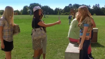 Clothing from Confessions of a Teenage Drama Queen: Megan Fox is wearing Burberry Check Top Handle Crossbody Bag to play Carla